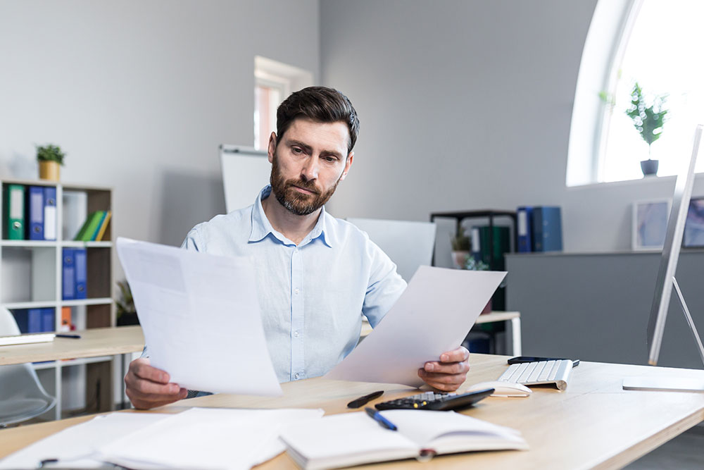 Accountant reviews business financials ahead of sale