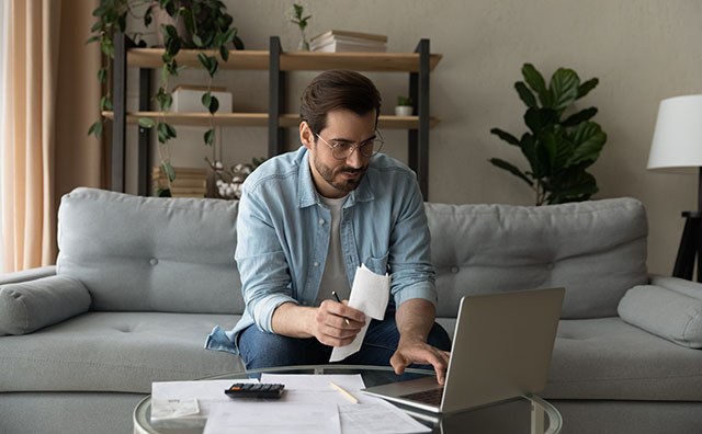 Man with receipts files his tax return