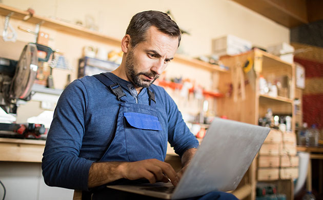 Business owner reviewing his tax return