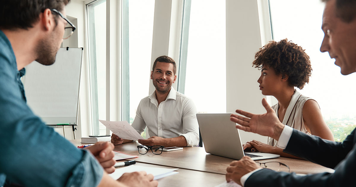 Team at tech startup discusses financial and tax strategy