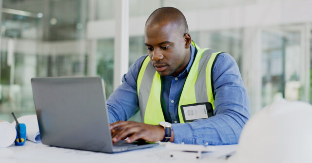 Contractor reviewing financial report