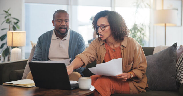 Affluent couple reviews tax documents